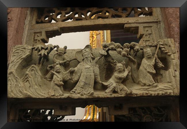 Buddhist bas-relief with sculptures of a family. Framed Print by Hanif Setiawan