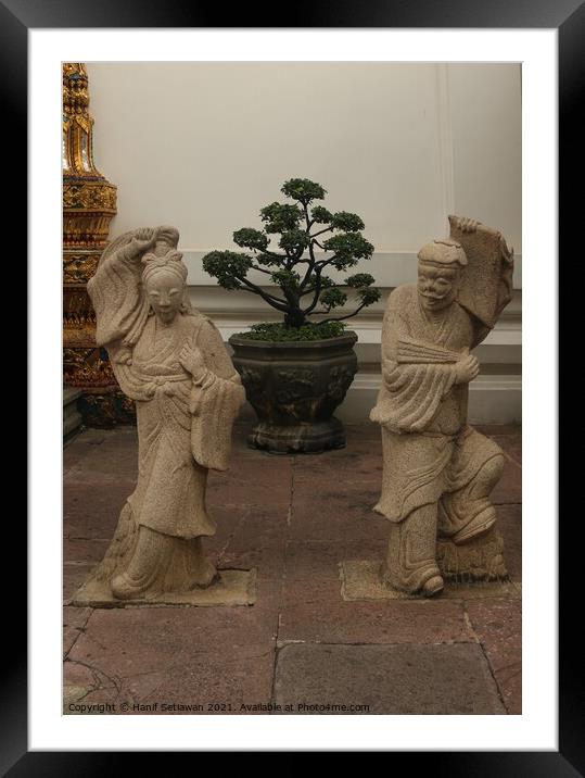 Stone sculptures art from Asian woman and man. Framed Mounted Print by Hanif Setiawan