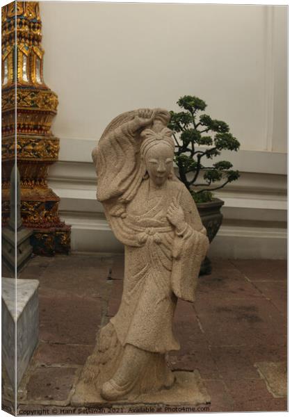 Stone sculptor art from an Asian woman. Canvas Print by Hanif Setiawan