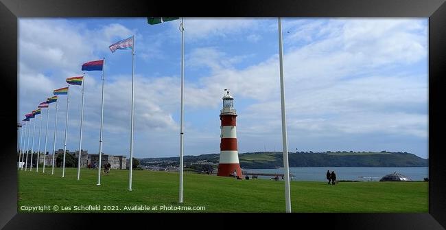 Plymouth Hoe  lighthouse and flags Framed Print by Les Schofield