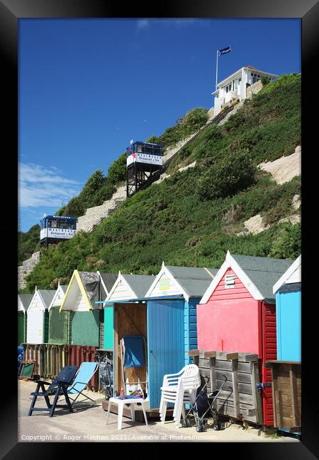 Charming Pastel Beach Huts Framed Print by Roger Mechan