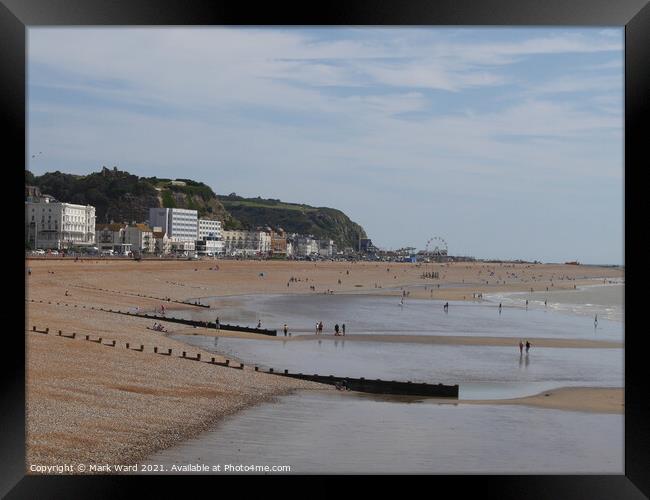 Hastings Seafront from the Pier in August. Framed Print by Mark Ward