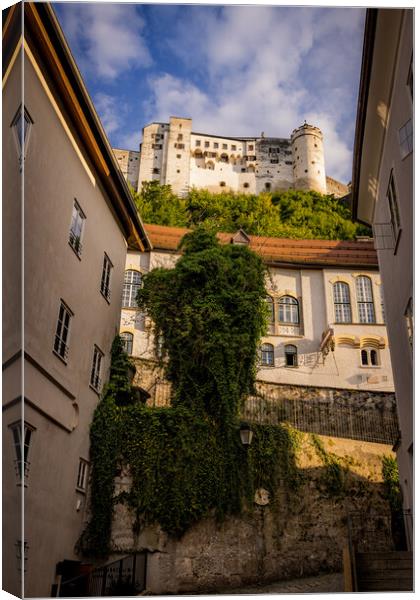 Street view in the old town of Salzburg with a view to the fortress Canvas Print by Erik Lattwein