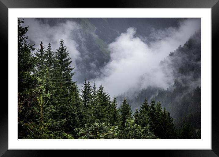 A rainy day in the Austrian Alps with deep clouds and fog Framed Mounted Print by Erik Lattwein