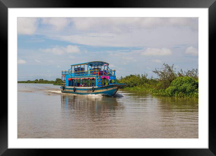 ferry boat at the Tonle Sap Lake in the Siem Reap Province Cambodia Framed Mounted Print by Wilfried Strang