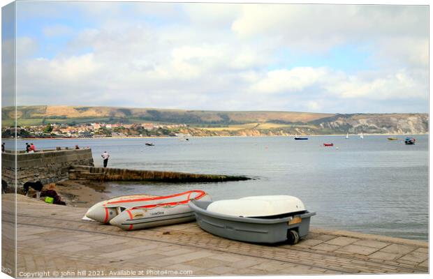 Swanage Bay in Dorset. Canvas Print by john hill