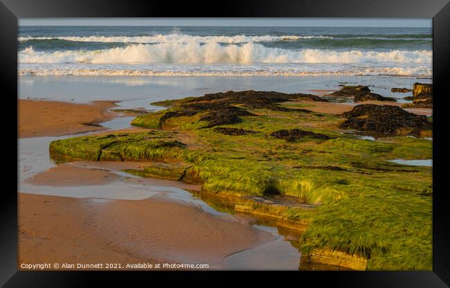 Falling sun and incoming tide Framed Print by Alan Dunnett