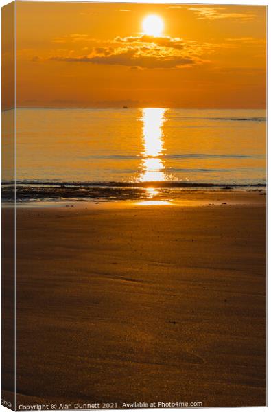 Sunrise and glitter on Embleton Beach, Northumbria Canvas Print by Alan Dunnett