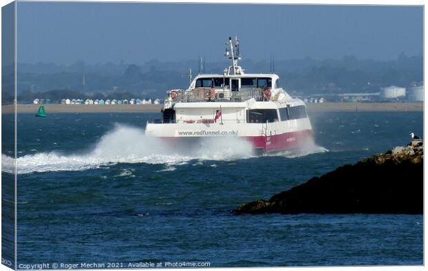 Catamaran Leaving Cowes Isle of Wight. Canvas Print by Roger Mechan