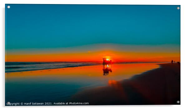 Horse-drawn carriage at sunset on beach Acrylic by Hanif Setiawan