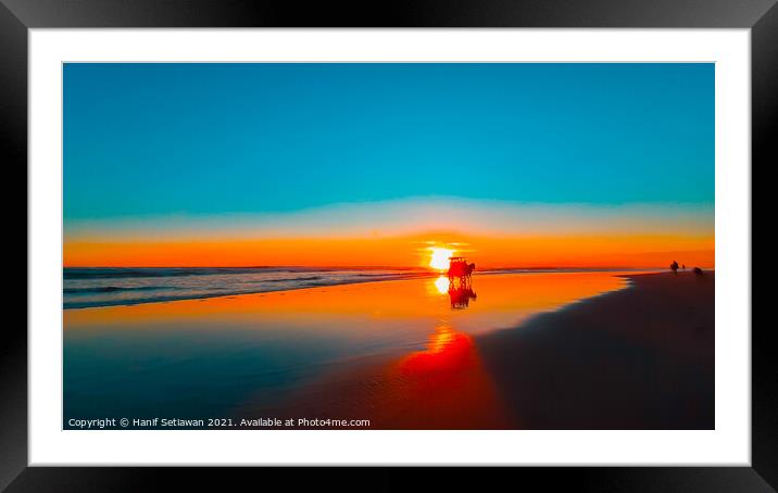 Horse-drawn carriage at sunset on beach Framed Mounted Print by Hanif Setiawan