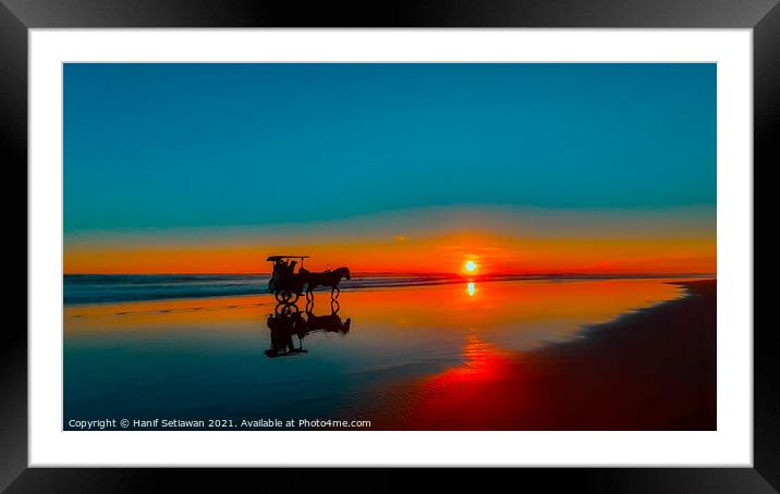 Horse-drawn carriage at sunset on beach Framed Mounted Print by Hanif Setiawan