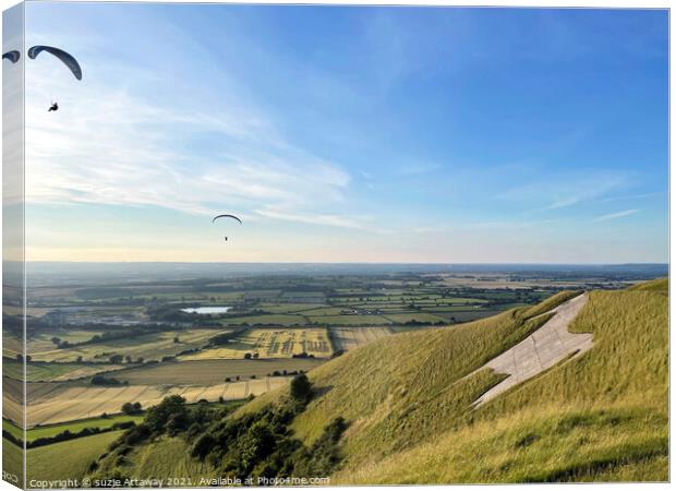 Paragliding at The White Horse, Westbury, Wiltshir Canvas Print by suzie Attaway