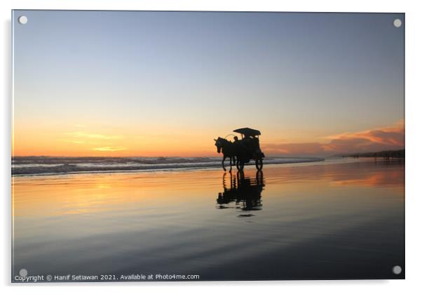 Horse-drawn carriage at sunset on beach Acrylic by Hanif Setiawan