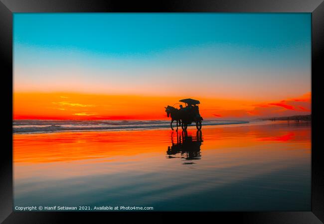 Horse-drawn carriage at sunset on beach Framed Print by Hanif Setiawan