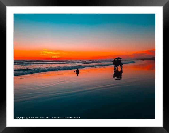 Horse-drawn carriage at sunset on beach Framed Mounted Print by Hanif Setiawan