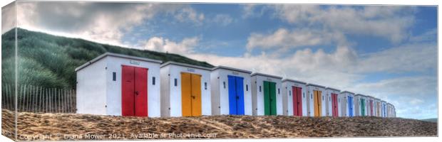 Colourful Beach Huts Devon Panoramic. Canvas Print by Diana Mower