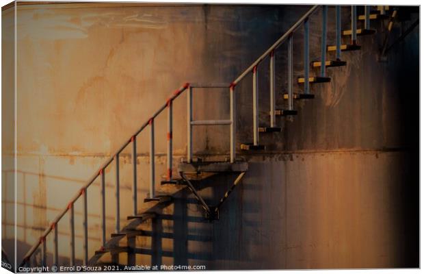 Golden glow on metal stairs outside an industrial  Canvas Print by Errol D'Souza