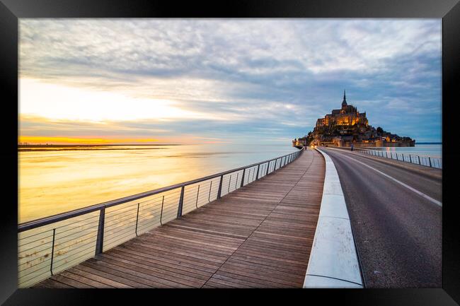 Le Mont Saint-Michel and the bridge over water in Normandy Framed Print by Laurent Renault