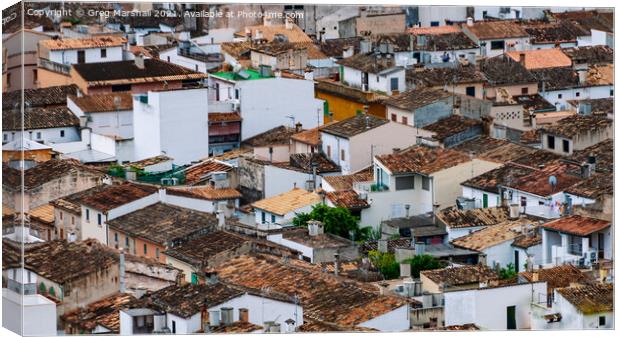 Rooftops in Pollensa Mallorca Canvas Print by Greg Marshall