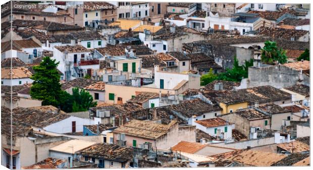 Rooftops in Pollensa Mallorca Canvas Print by Greg Marshall