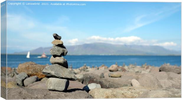 Stacked stones at the coastline of Reykjavik, Iceland Canvas Print by Lensw0rld 