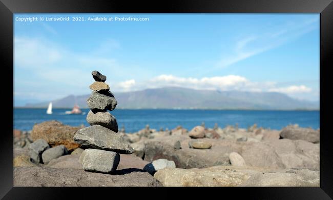 Stacked stones at the coastline of Reykjavik, Iceland Framed Print by Lensw0rld 
