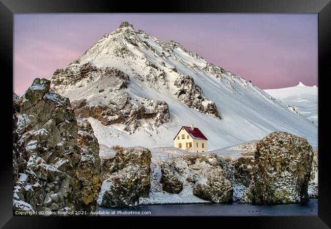 Snow covered mountain and home Framed Print by Giles Rocholl