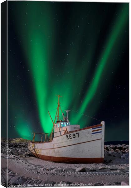 Northern lights over fishing boat Canvas Print by Giles Rocholl
