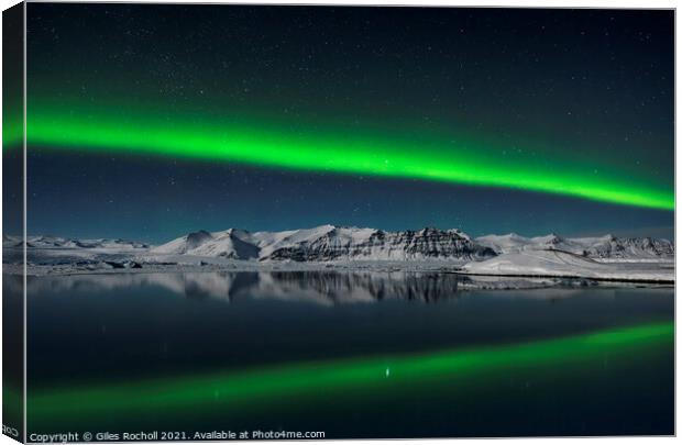 Northern lights over Iceland mountain and lagoon Canvas Print by Giles Rocholl