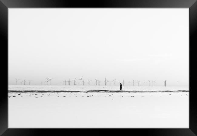 Silhouette of an Iron Man in black and white Framed Print by Jason Wells