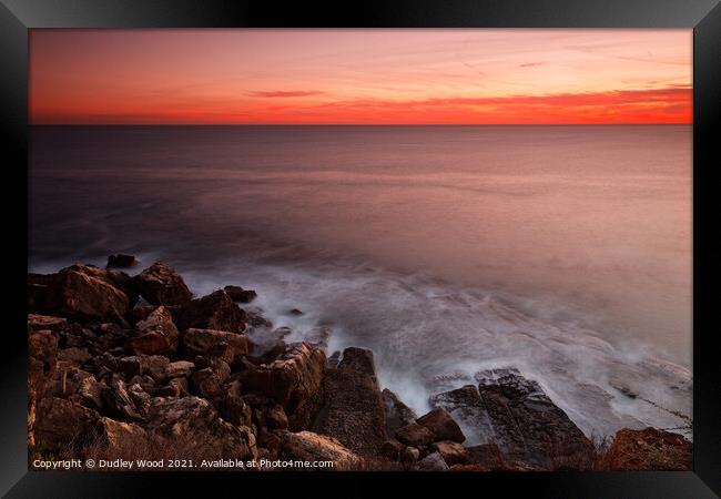 Serene Sunset over Rocky Horizon Framed Print by Dudley Wood