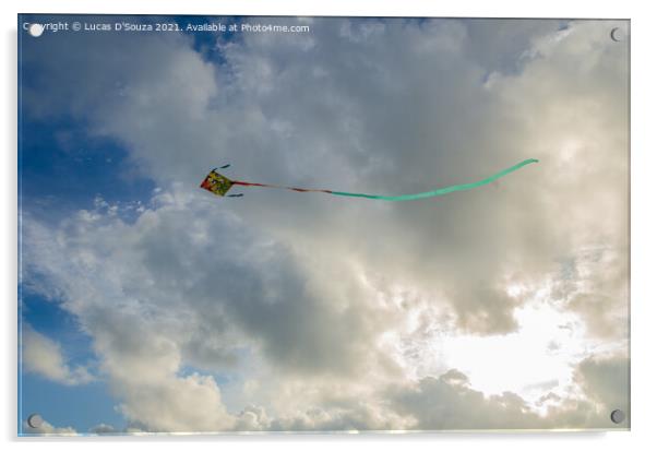 Kite flying against backdrop of beautiful clouds Acrylic by Lucas D'Souza