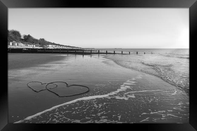 Hearts in the sand at Frinton-on-Sea Framed Print by Paula Tracy
