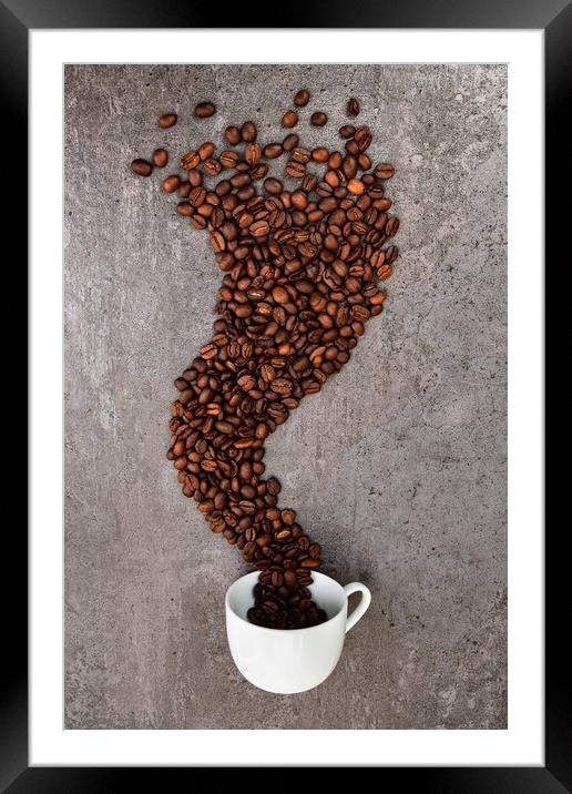 Spilled cup of coffee with beans as smoke shape Framed Mounted Print by Laurent Renault