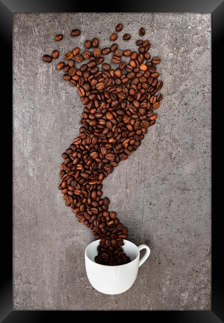 Spilled cup of coffee with beans as smoke shape Framed Print by Laurent Renault
