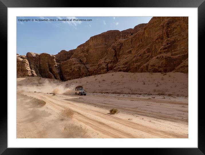 Jeep speeding through Wadi Rum, Jordan Framed Mounted Print by Jo Sowden