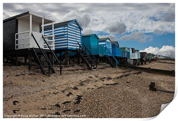 Beach huts at low tide Print by Doug McRae
