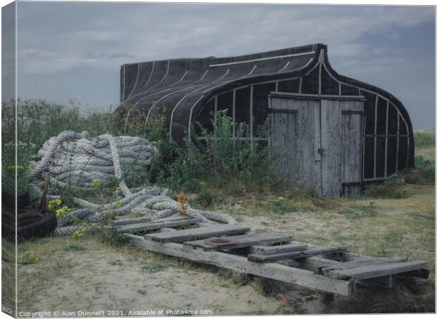 Holy Island Boat shed Canvas Print by Alan Dunnett