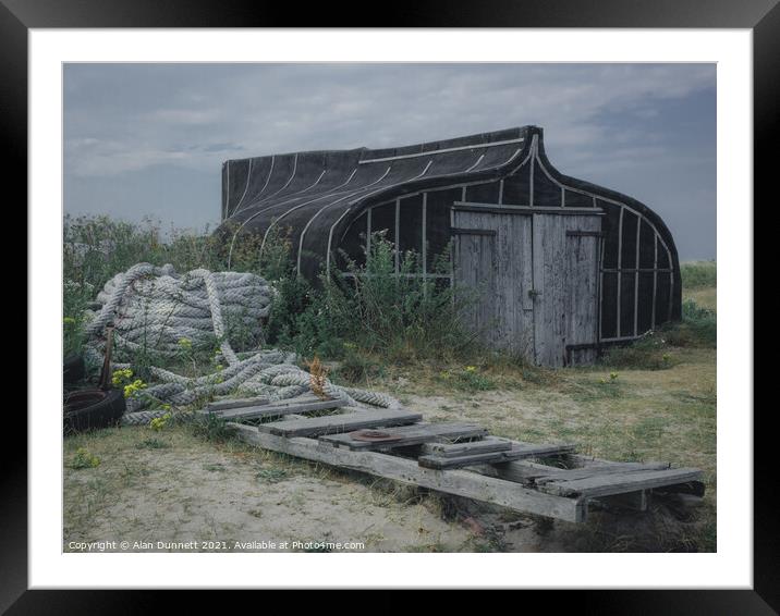 Holy Island Boat shed Framed Mounted Print by Alan Dunnett