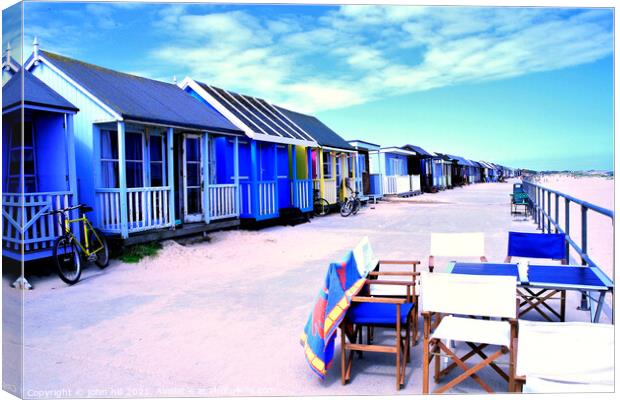 Promenade beach huts, Sandilands, Lincolnshire, UK. Canvas Print by john hill