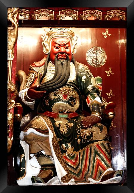 Iconic Confucian statue in Chinese temple Framed Print by Roger Mechan