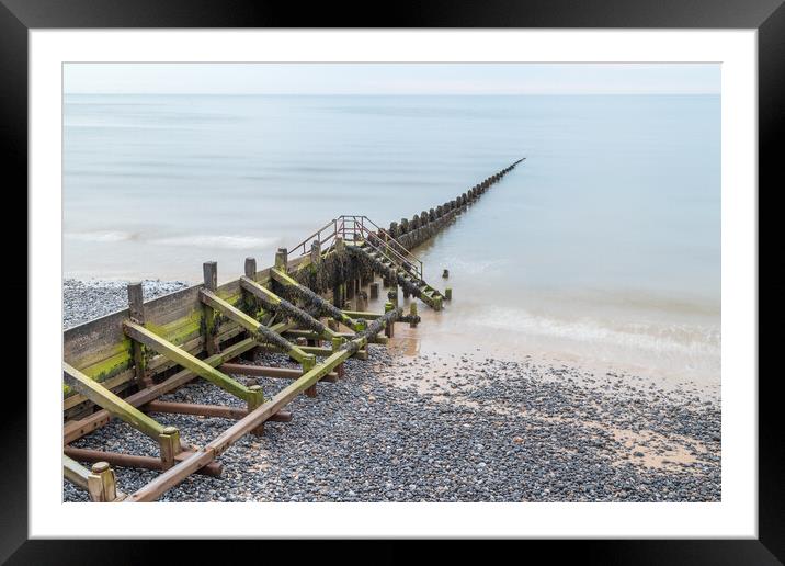 Wooden groyne stretching into the sea Framed Mounted Print by Jason Wells