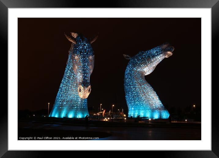 The Kelpies in blue. Framed Mounted Print by Paul Clifton