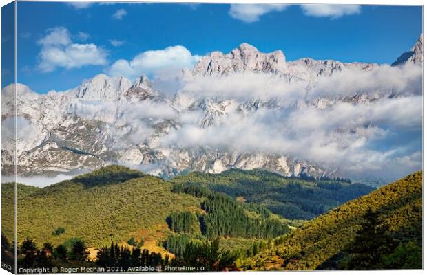 Misty Mountains at Sunrise Canvas Print by Roger Mechan