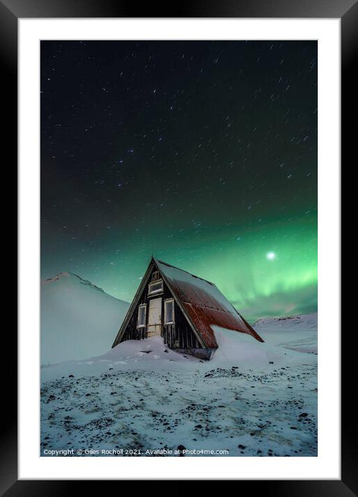 Snowy cabin and northern lights Framed Mounted Print by Giles Rocholl