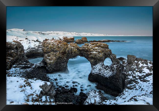 Snowy sea arch Iceland Framed Print by Giles Rocholl