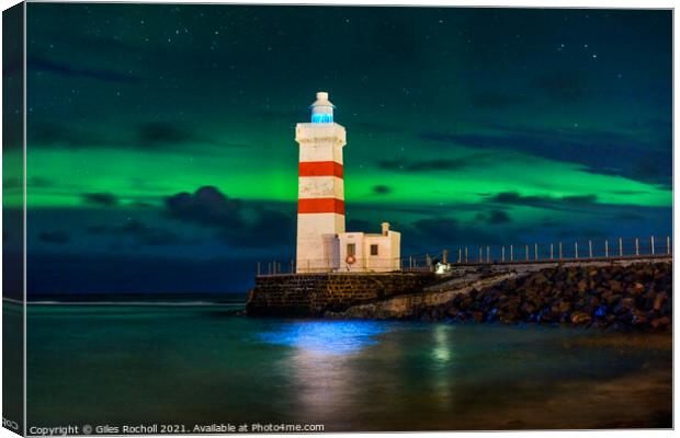 Northern lights and lighthouse Iceland Canvas Print by Giles Rocholl