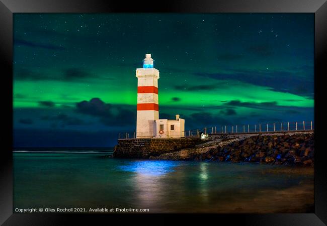 Northern lights and lighthouse Iceland Framed Print by Giles Rocholl