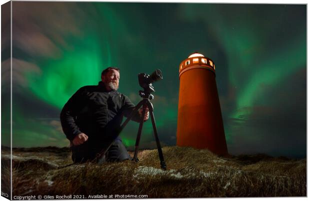 Photographer light house and northern lights Iceland Canvas Print by Giles Rocholl